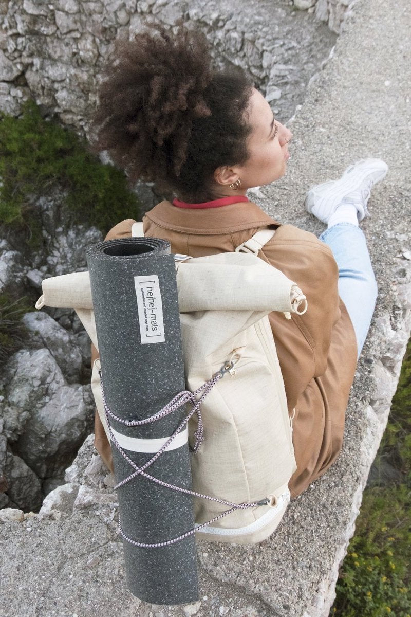 yoga mat attached to backpack straps